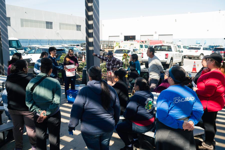 Participants gather for an open-air discussion at the CRA training site.